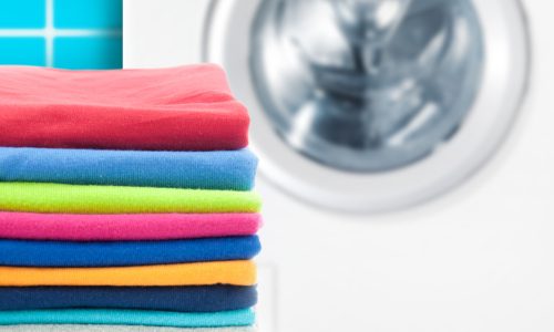 Should you wash new clothes before you wear them? 
Pile of colorful clothes with washing machine.; Shutterstock ID 226661083; PO: new-clothes-wash-before-wear-today-tease-150519; Client: TODAY digital